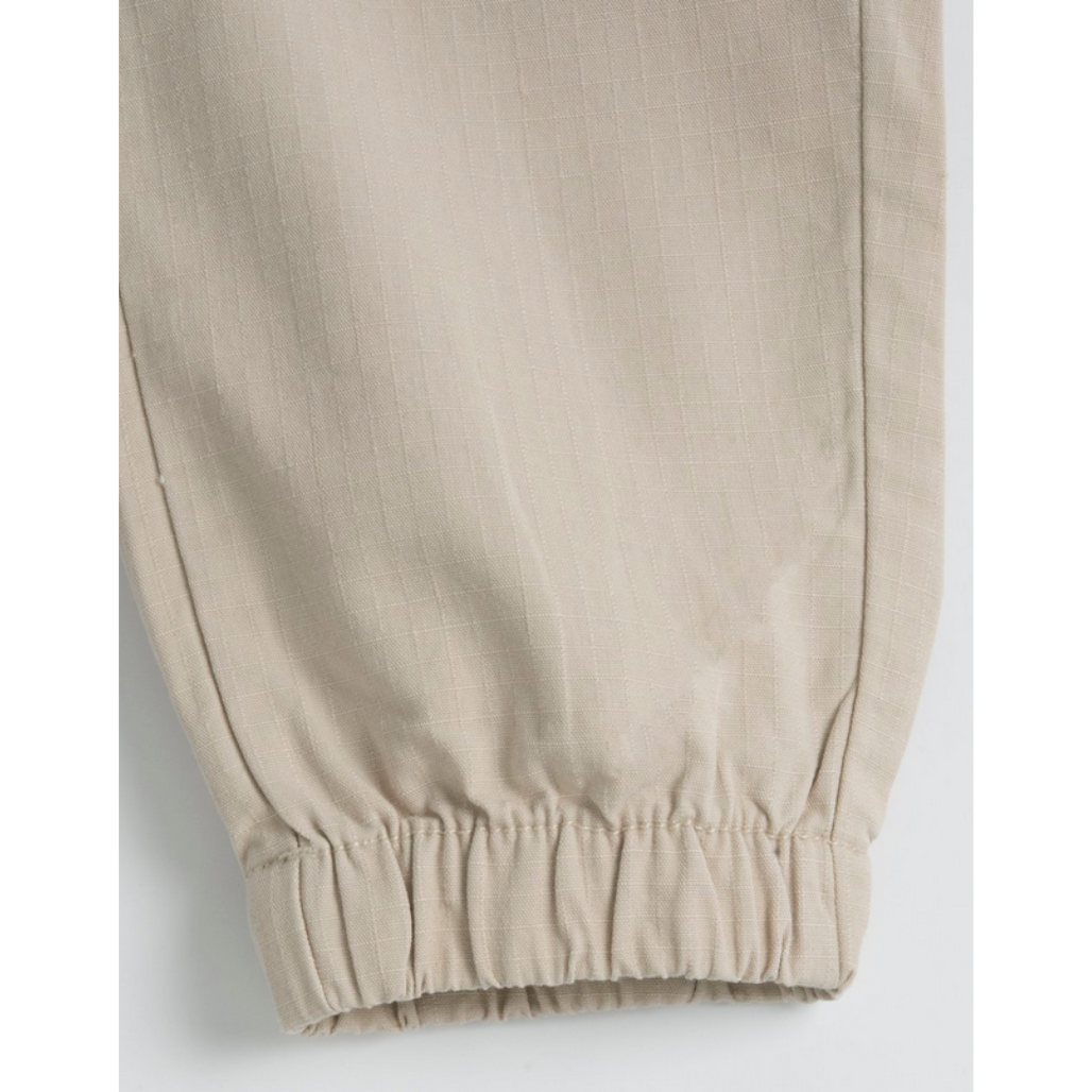 Chicco Kinder Cargo Hose in Beige mit elastischem Bund, Kordelzug und seitlichen Taschen, bequem und funktional für den Alltag